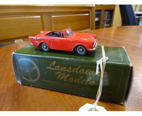 A Lansdowne Models white-metal 1:43 scale 1963 Sunbeam Alpine Series III Soft-Top (LDM 11). In red with black interior and 'w