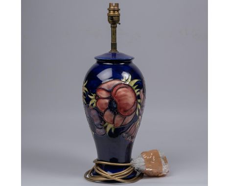 A Moorcroft pottery lamp vase. With anemone design on dark blue ground. Marks to base, MH. H.435mm. VGC. £40-60 