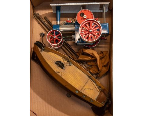 A Wilesco live steam Traction Engine in blue, white and red. Together with a small wooden pond yacht for restoration. Tractio