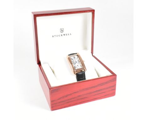 A ladies cased Stockwell wrist watch. The watch having an engine turned design to the face with sub dial minute hand and blac
