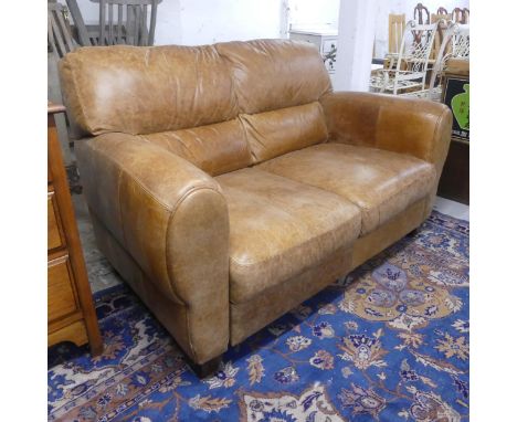 A contemporary brown leather upholstered two seater sofa. Overall dimensions width 156cm, height 90cm, depth 98cm. Seat width