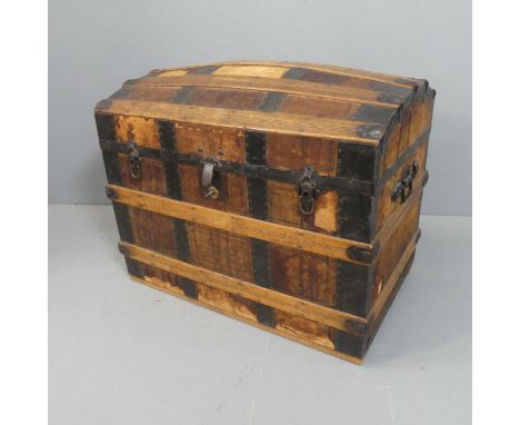 A Victorian metal-bound dome-top trunk with compartmented tray-fitted interior. Width 89cm, height 72cm, depth 55cm.