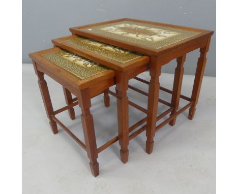 A mid-century nest of the three Danish teak tile-top occasional tables. Largest - width 52cm, height 45cm, depth 37cm.