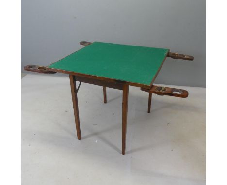 An early 20th century mahogany folding card table with folding cup and counter holders. Width 76cm, height 69cm.