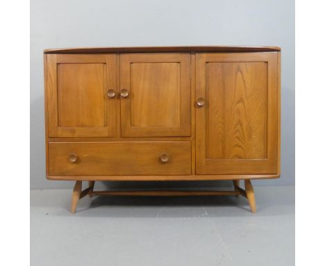 ERCOL - A mid-century elm model 467 sideboard, with single drawer and three panelled cupboard doors, and maker's label to int