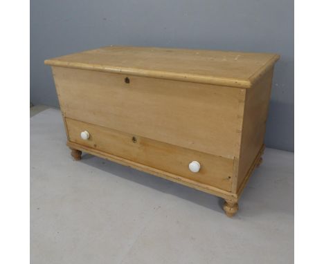 An antique pine trunk, with drawer to base. Width 116cm, height 68cm, depth 56cm.