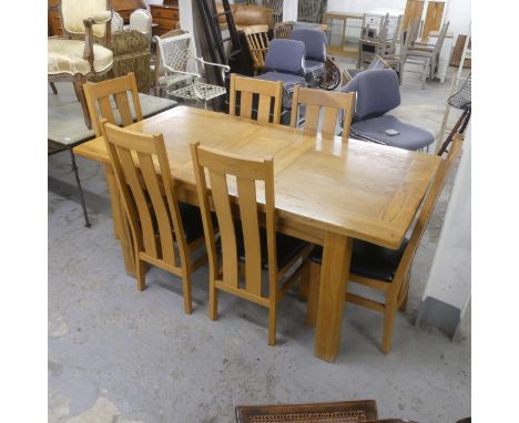 A modern light oak draw leaf dining table (with one spare leaf). Max length 171cm, height 79cm, width 90cm and six matching M