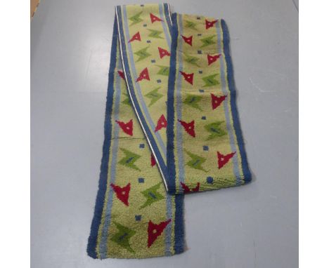 A mid-century hand tufted carpet runner with abstract arrow head design. Length 285cm, width 48cm.