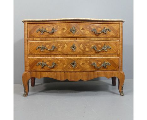A French Kingwood and marble topped serpentine-fronted commode chest of three drawers, with inlaid floral decoration and ormo