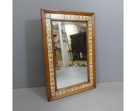 A Tuscan style rectangular wall mirror with painted tile decoration. Width 63cm, height 94cm.