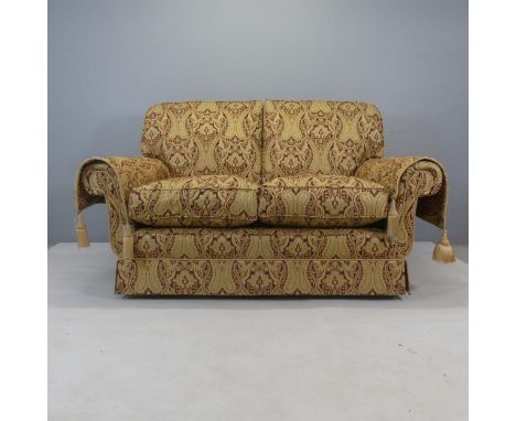 A Delphic range red and gold upholstered two seater sofa by Peter Guild. Overall width 160cm, height 102cm, depth 105cm. Seat