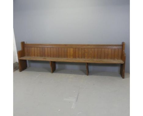 A vintage oak church pew. Length 298cm, height 90cm, depth 43cm.