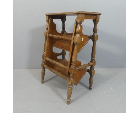 An antique mahogany metamorphic library step / side table. Dimensions as steps - width 50cm, height 75cm, depth 62cm.Dimensio