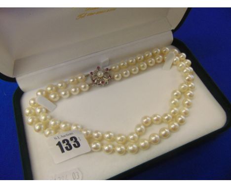 A two row uniform cultured Pearl necklace with 9mm Pearls on a 18ct white gold and Ruby clasp, pearls length approx 32cms&nbs