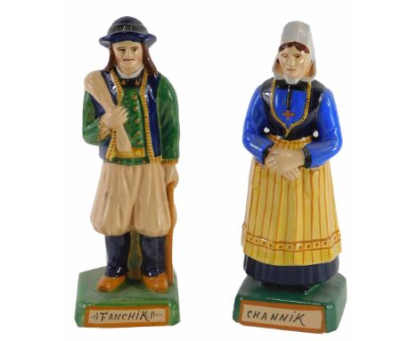 A pair of Henriot Quimper Faience figures, of gentleman and a lady stamped Fanchik and Channik respectively, 25cm high. 