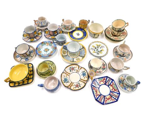 A large quantity of French Faience souvenir cups and saucers, to include Quimper, various designs, to include Tartan. 