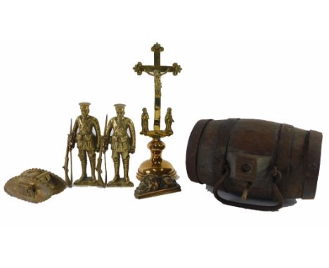 A scale brass model of a First World War tank, two brass figurines of soldiers with rifles, a cross, a model of a lion, an a 