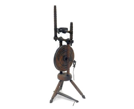 A bobbin turned hardwood spinning wheel, 96cm high.