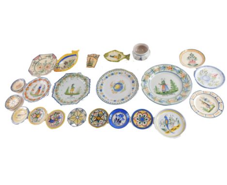 A quantity of small novelty French Faience pieces, to include two Quimper fish dishes, small plates, etc. 