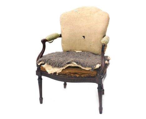 A George III mahogany French style open armchair, in the manner of Thomas Chippendale, with a padded back, arm rest and seat,