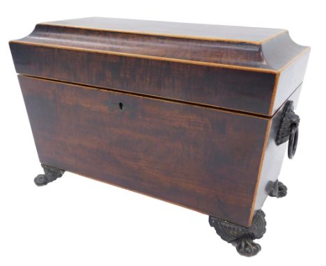 A 19thC rosewood sarcophagus shaped tea caddy, the hinged lid enclosing two lidded compartments, on bun feet, 23cm wide. 