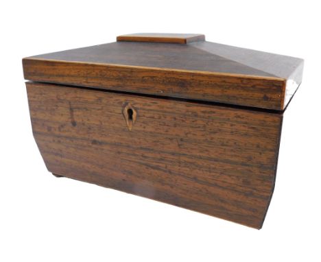 A George IV mahogany and boxwood strung sarcophagus shaped tea caddy, with cast metal side handles and feet, the hinged lid e