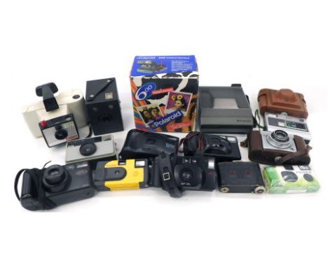 A group of camera equipment, comprising a Polaroid 600 Instant camera, a Polaroid Image System camera Apparel Photo, Kodak di