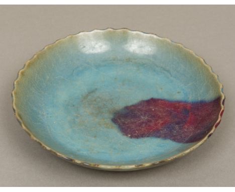 A Chinese Jun ware pottery bowlWith scalloped top rim and typical glaze.  21.5 cm diameter.  CONDITION REPORTS: Some crazing,