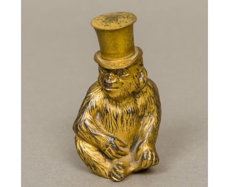 A late 19th century German gilded metal lighter Formed as a monkey wearing a removable top hat, the reverse inscribed Gerschu
