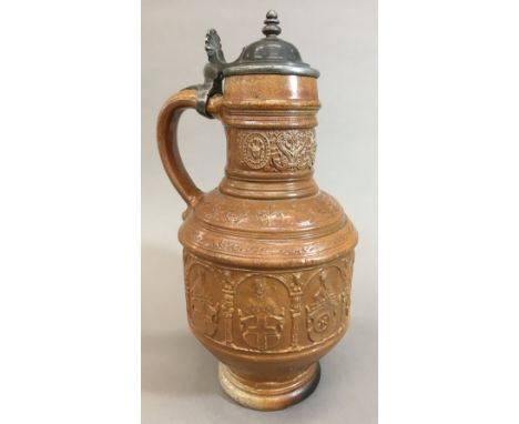 An early 17th century Raeren stoneware seven electors panel jug, dated 1602Typically worked with portrait panels of the Holy 