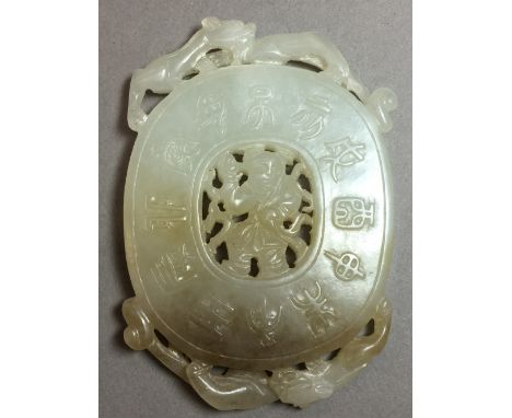 A Chinese carved celadon and russet jade roundel, possibly 18th centuryCentrally carved with a figure within archaistic symbo