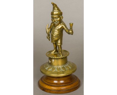 A Victorian brass Mr Punch bar top lighterTypically formed as Mr Punch with a cigar in his mouth and holding a quill and a ca