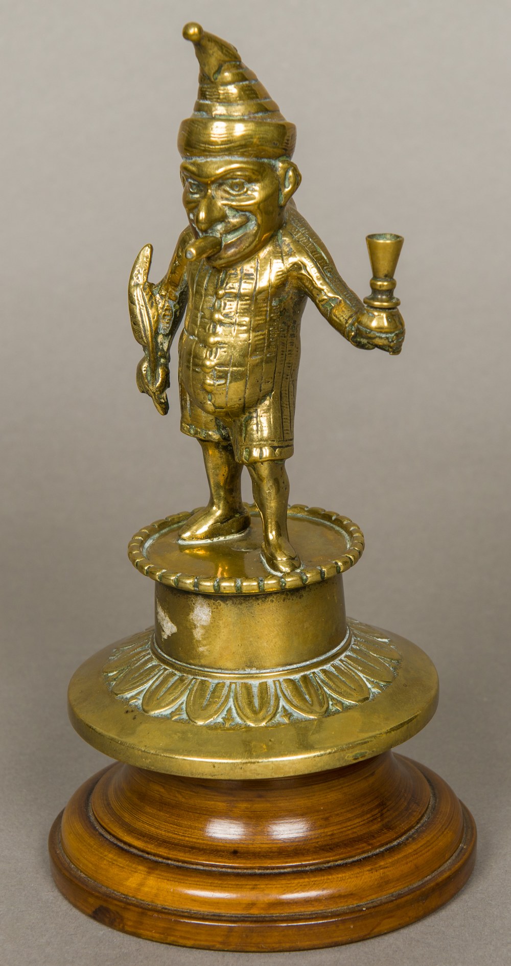 A Victorian brass Mr Punch bar top lighterTypically formed as Mr Punch