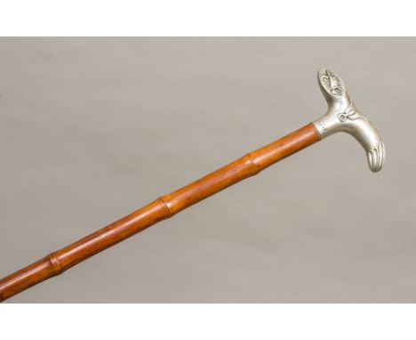 A Victorian silver handled walking stick, hallmarked London 1895, makers mark indistinctThe handle formed as a horse's saddle