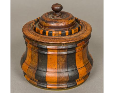 A 19th century Dutch specimen wood tobacco boxOf waisted turned lidded form, with interior metal lid.  13.5 cm high.  CONDITI