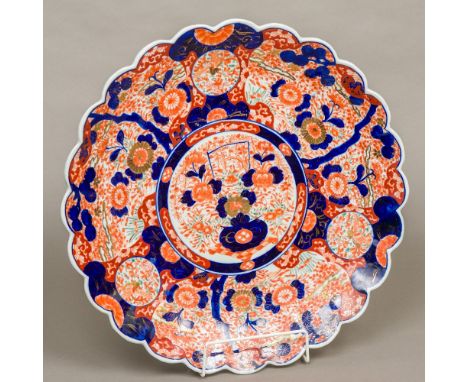 A 19th century Japanese Imari chargerOf scalloped edge form, typically decorated to the interior.  45.5 cm diameter.  CONDITI