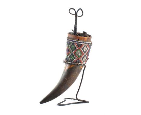 HORN VASE ON A STEEL STAND WITH BEADWORK COLLAR, INCLUDES SOME TOOLS INSIDE TOP OF HORN - - HEIGHT 16 INCHES X WIDTH 18 INCHE