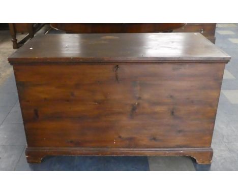 A Late 19th Century Stained Pine Lift Top Blanket Chest with Bracket Feet, 125cm Wide 