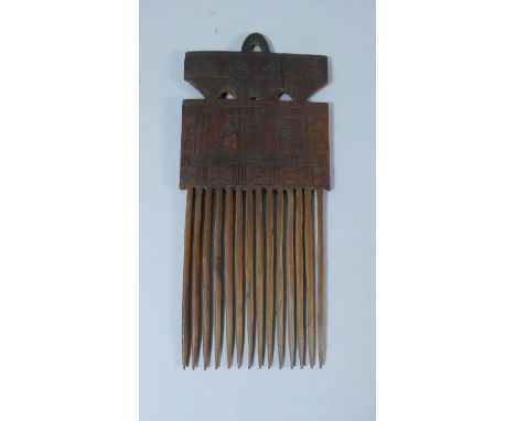 A Carved Colonial Comb with Inscribed Decoration Depicting Crucifix, Flags, Pyramids etc, 27cm High 