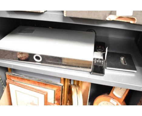 A Loewe digital blue ray CD player with remote and stand