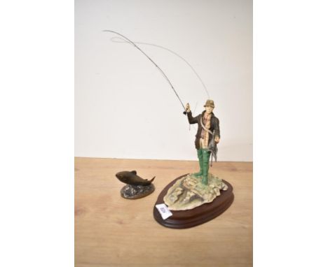 A Border Fine Arts figure 'Fly Fisherman' having damage to rod sold along with a Bronze Age Salmon study