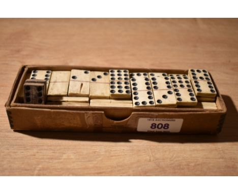 An almost complete set (54) double nine small bone dominoes