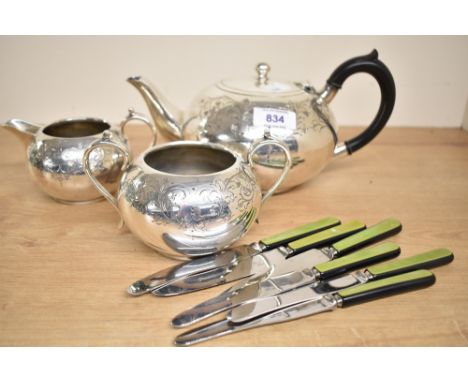 A silver plated tea pot, sold together with 6 Zenith butter knives a cream jug and a twin handled sugar bowl