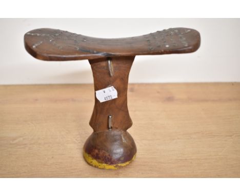 An African tribal wooden head rest with stud work decoration, h16.5cm