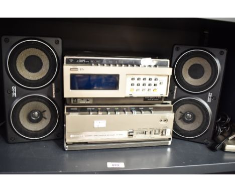 A Hitachi Portable Video Cassette Recorder VT-6500E, a Hitachei video tuner TU65E and a pair of Pioneer TS-X5 speakers