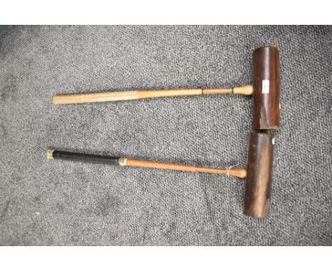 A pair of early 20th century Slazenger 'Corbally' croquet mallets, L77cm, (2).