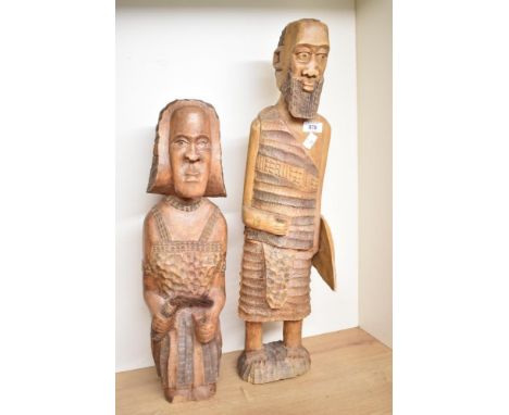 A pair of wooden African sculptures, hand carved with shield, missing spear, largest h63cm, ( 2 ).