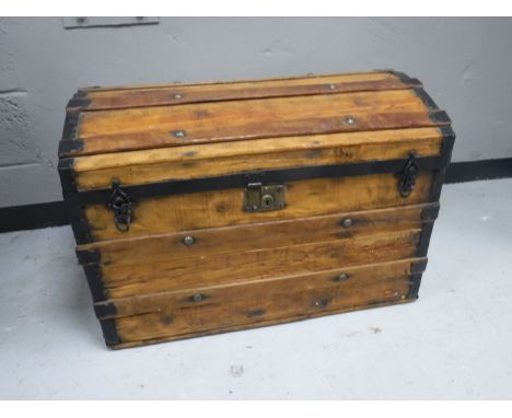 An antique pine metal bound shipping trunk