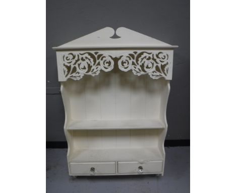 A white painted kitchen wall shelf, fitted two drawers