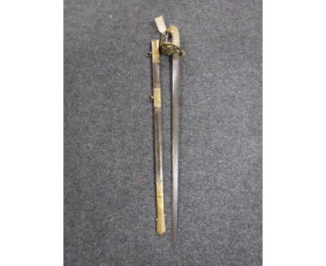 A 19th century naval officer's sword in leather scabbard 